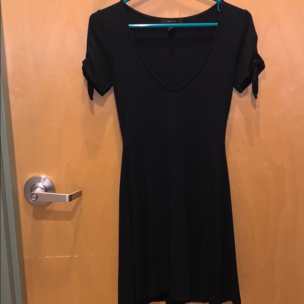 Black dress. Low cut. Very nice quality.